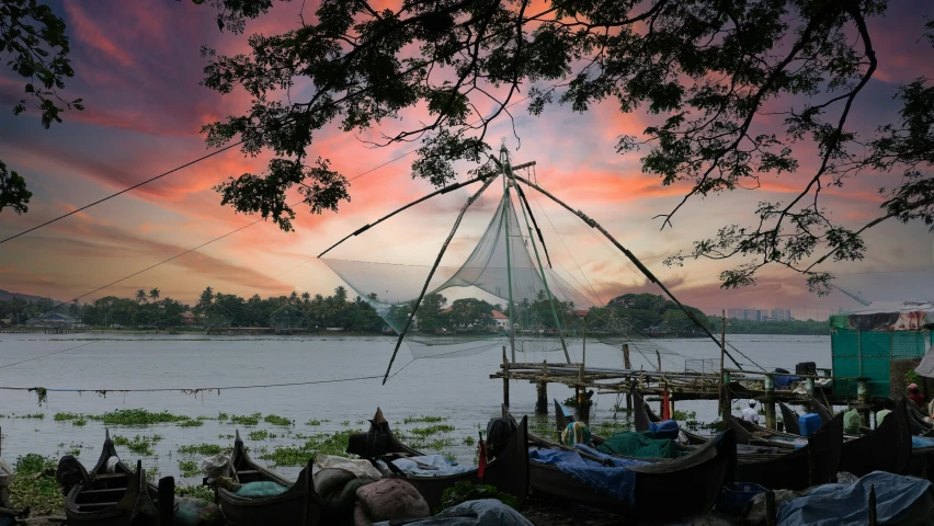 people are standing under a boat that is sitting on land