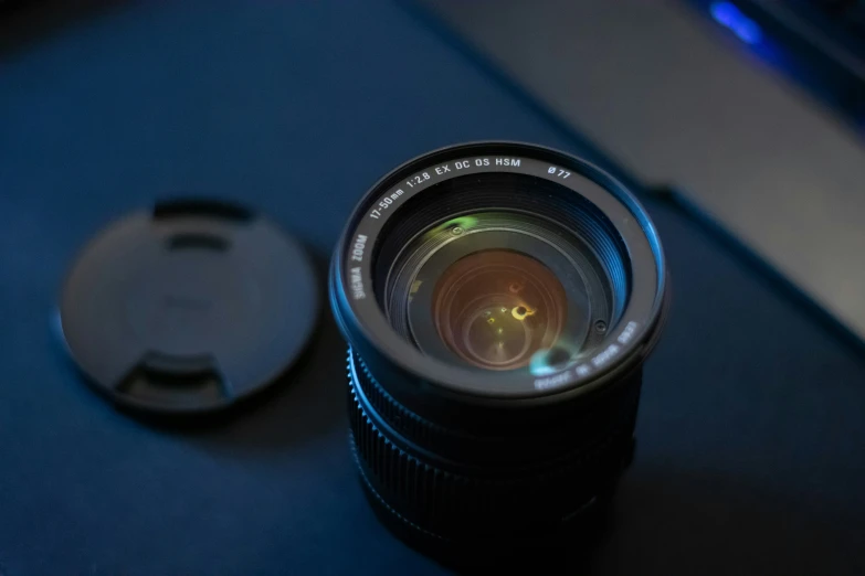 a lens sits next to an object on a table