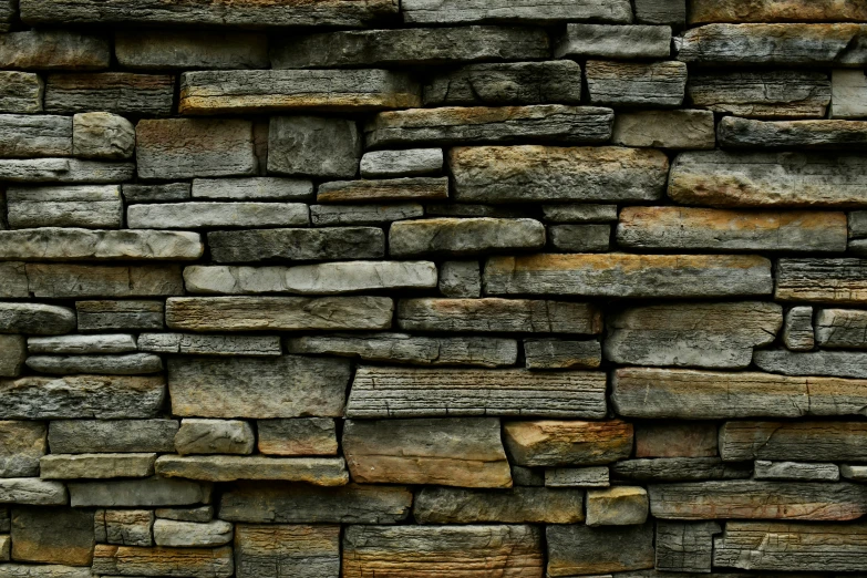 stone wall made of various sized and colored stones