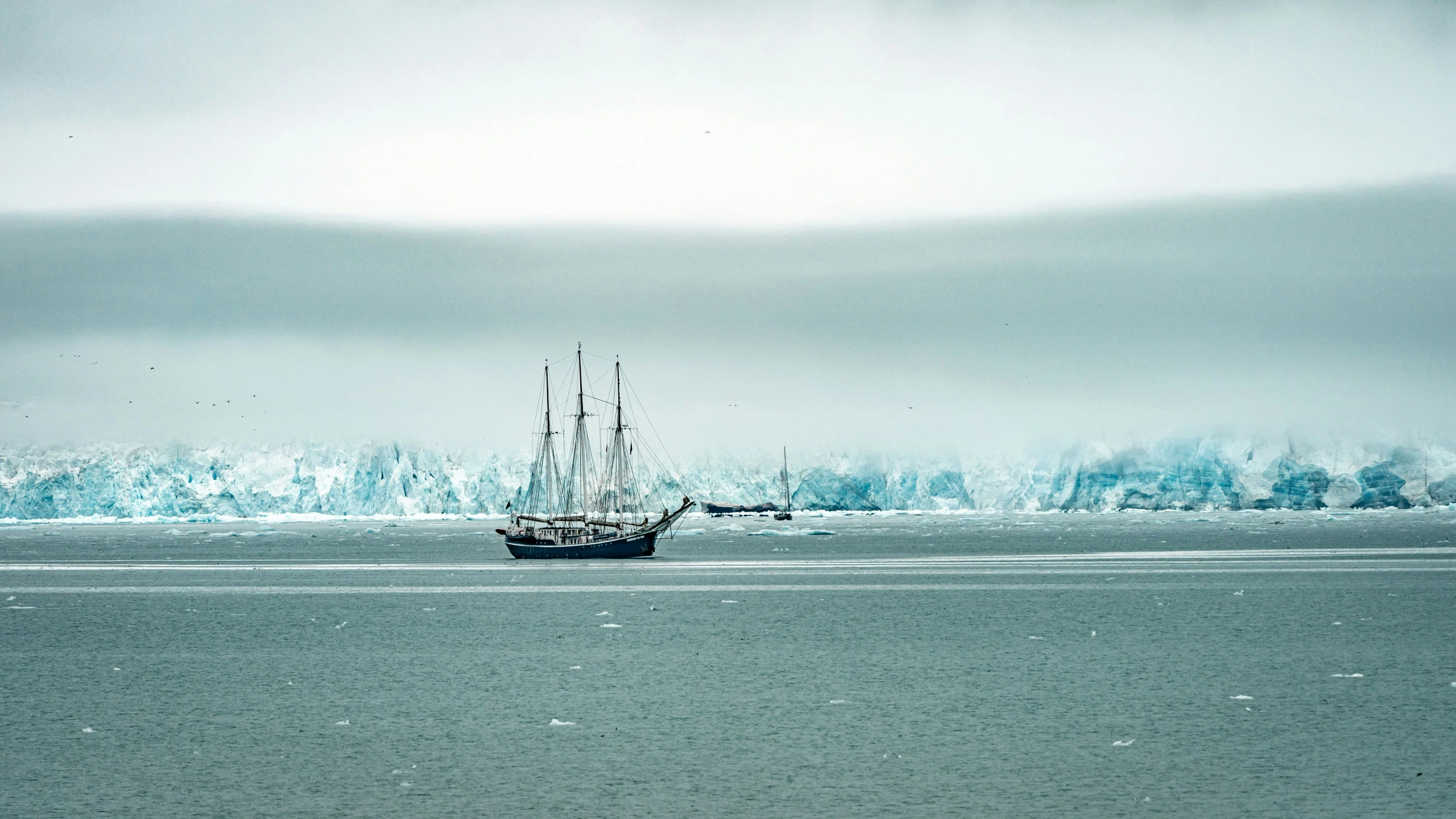 a large sail boat is in the ocean