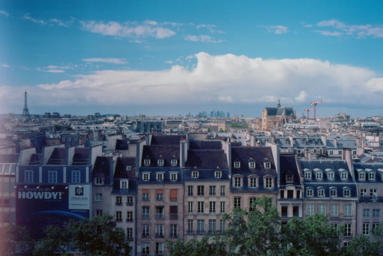 a view from a distance of many buildings