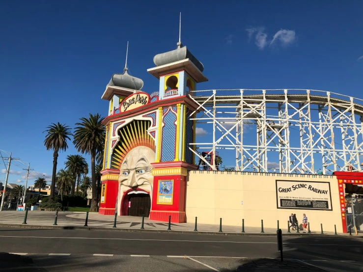 the tall clock tower has an ornate roof