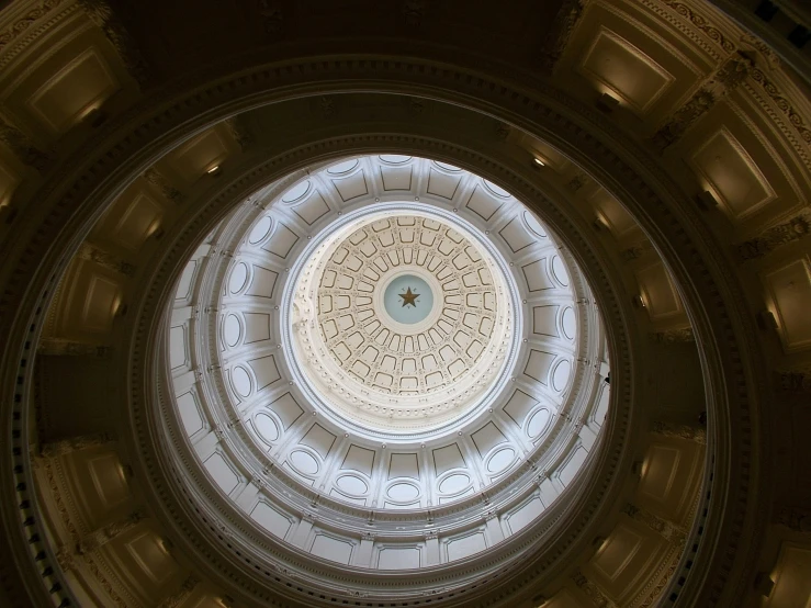 the ceiling of a building with a very large circle