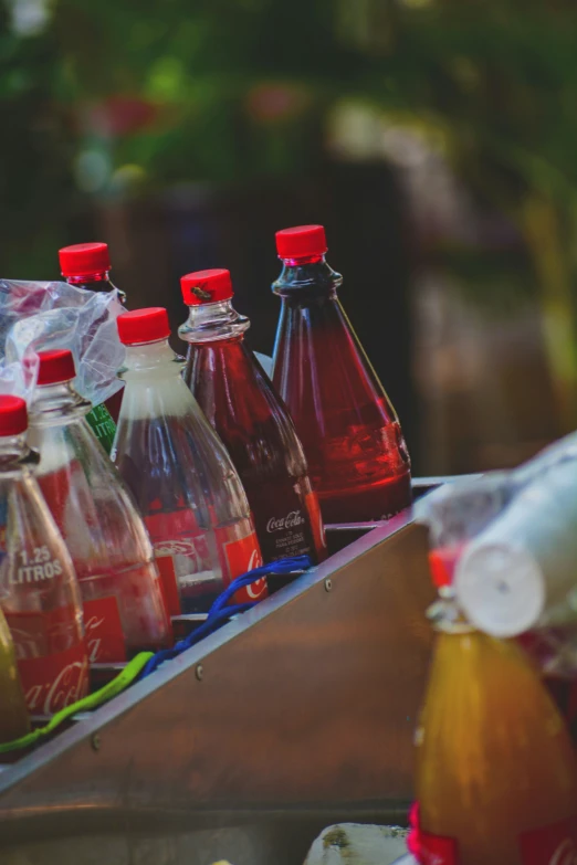 bottles are lined up beside each other next to a counter