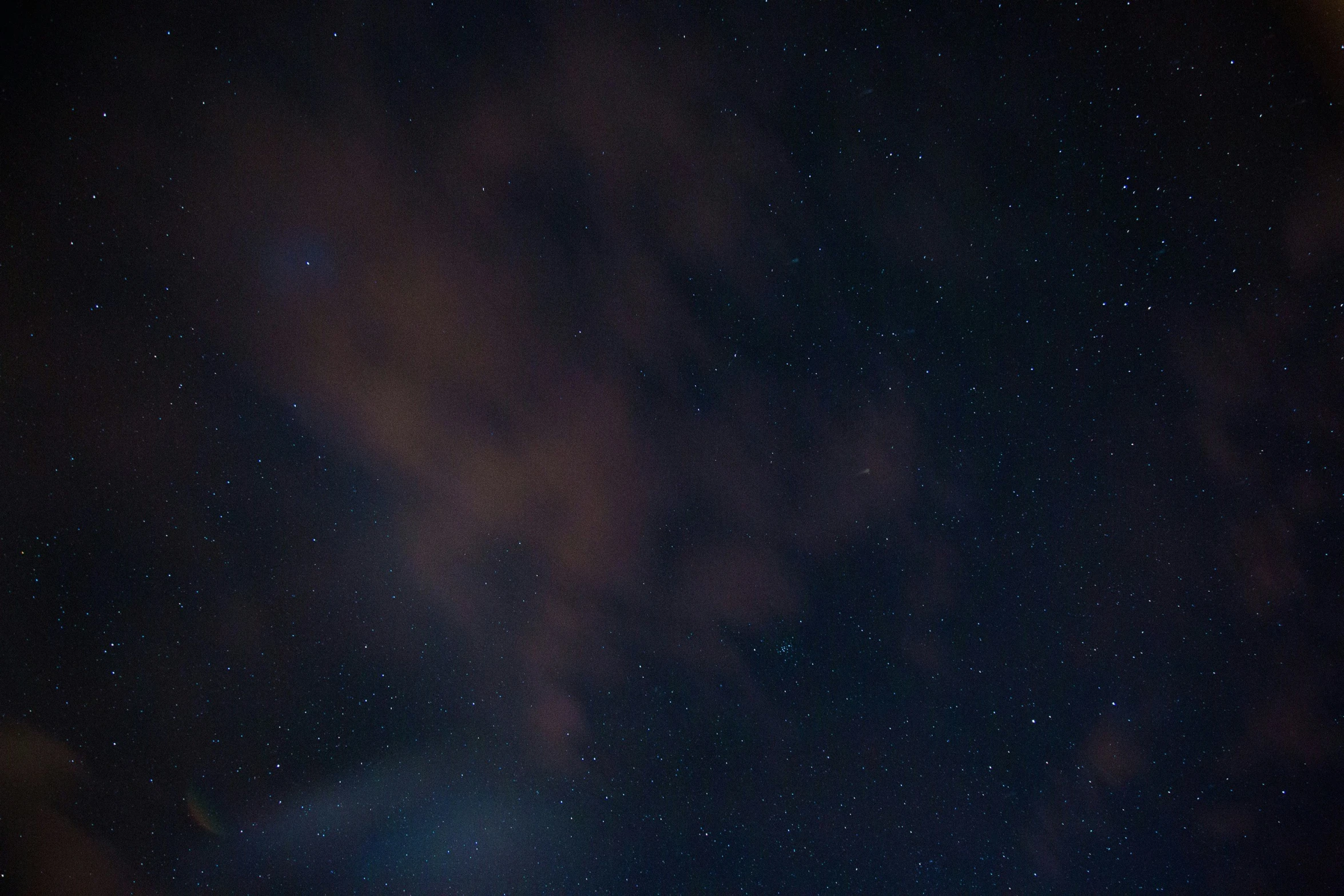 a blue and white sky with stars all over