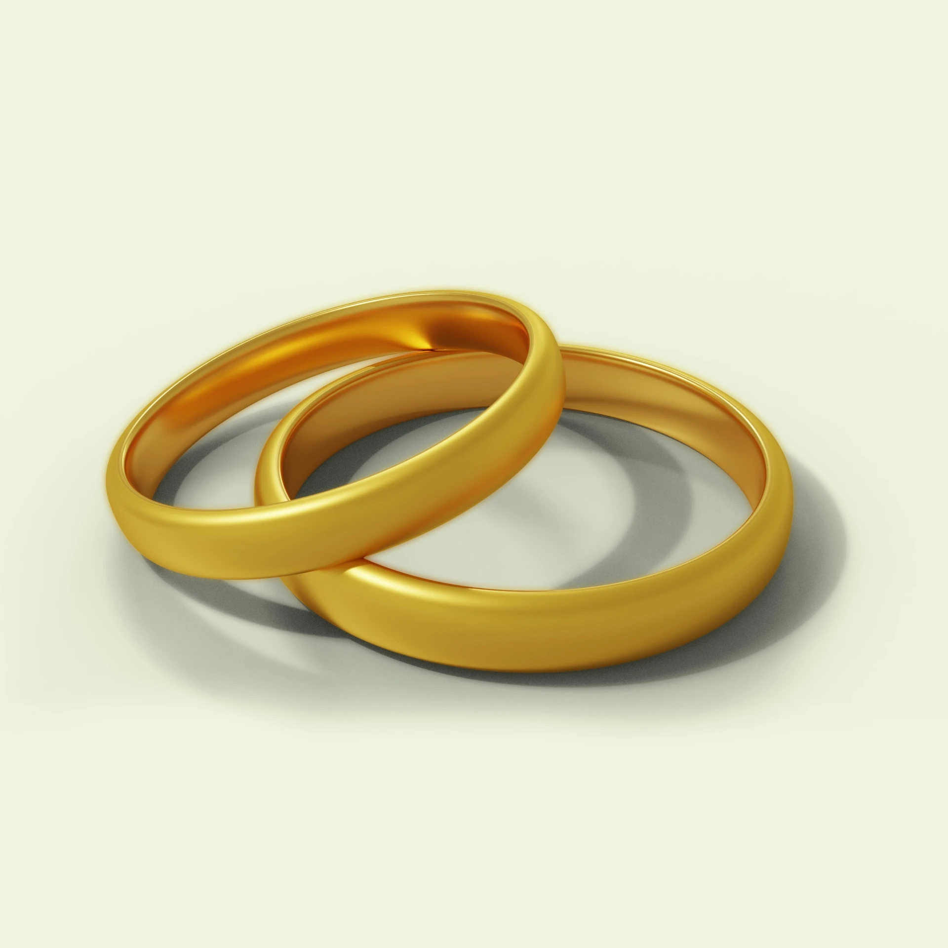 two gold rings sitting next to each other