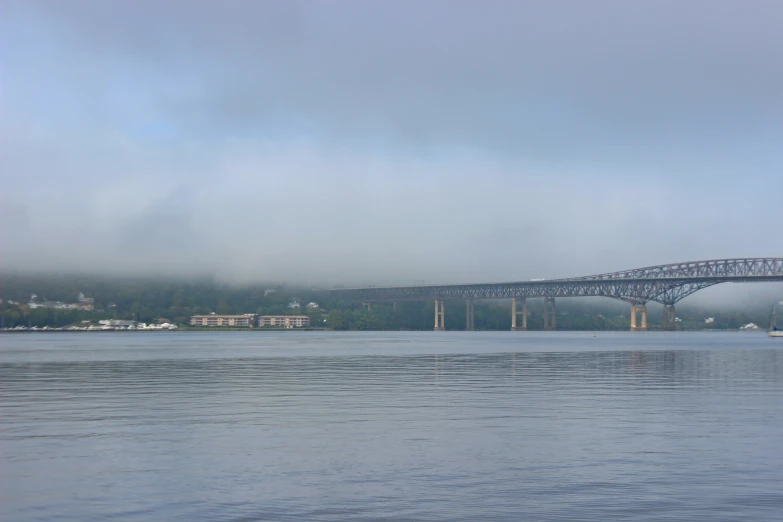 the bridge goes across the large body of water