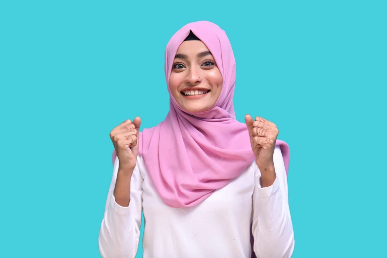 a woman wearing a hijab is posing for a po