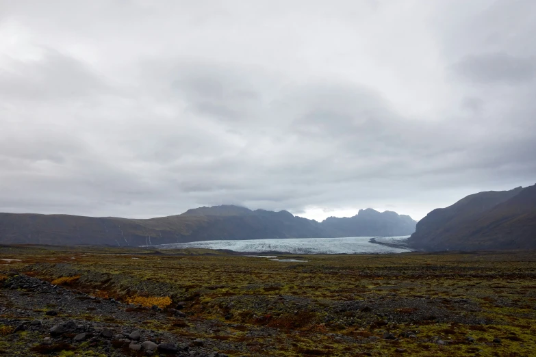 an area with very pretty mountains and a big body of water