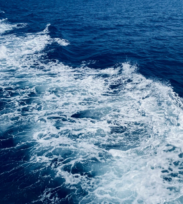 the wake of an ocean boat as it makes its way through the water