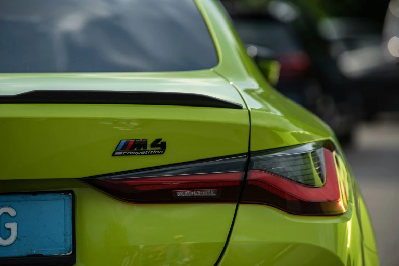 a neon green car parked near other cars