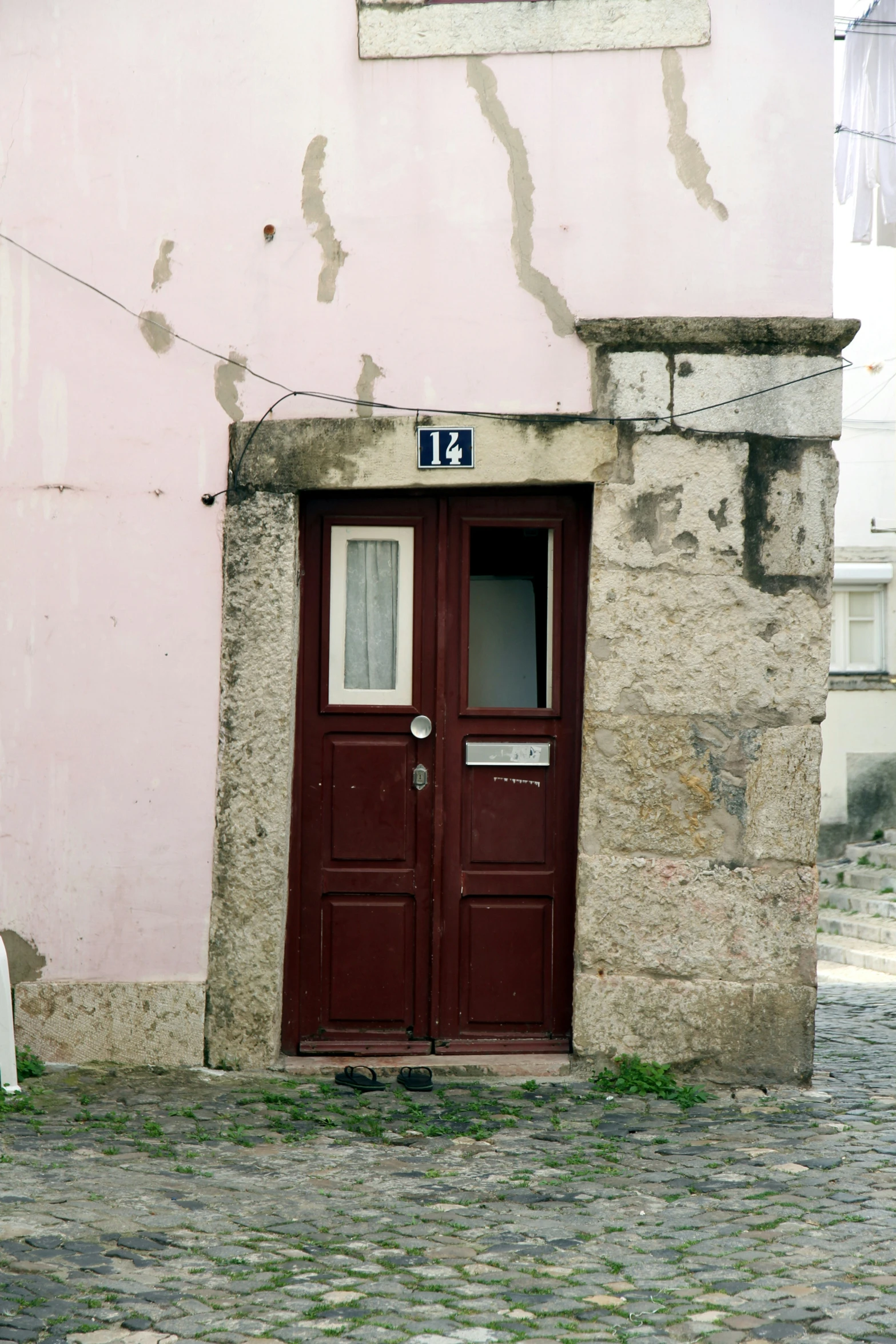 a doorway is shown with a red door