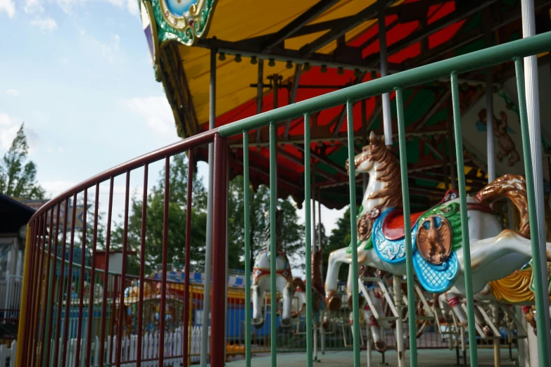 a carousel ride with some animals sitting on top of it