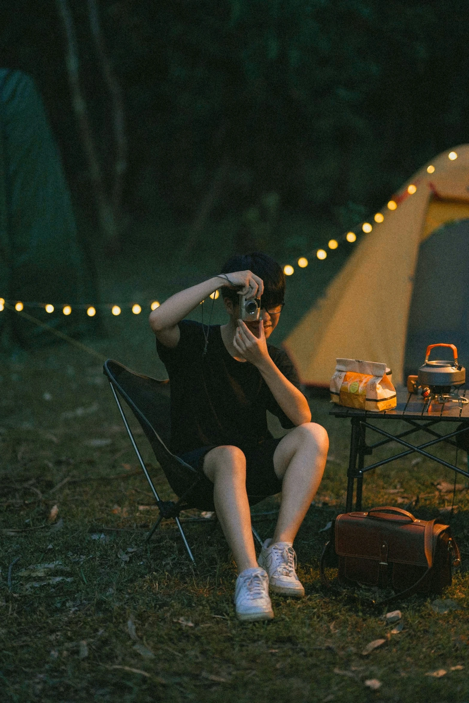 a woman takes her own pictures of a tent