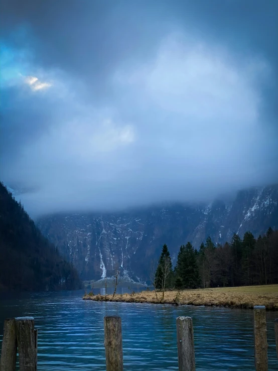 the mountain lake is next to a bridge