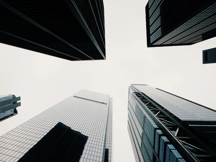 looking up at tall buildings from the ground