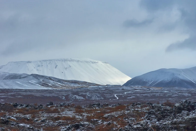 some hills covered with snow and a hill