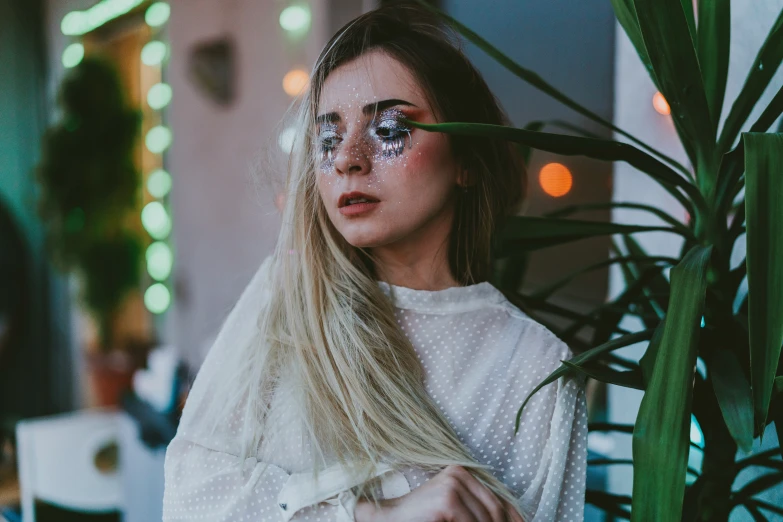 a woman with glasses looking sad and serious