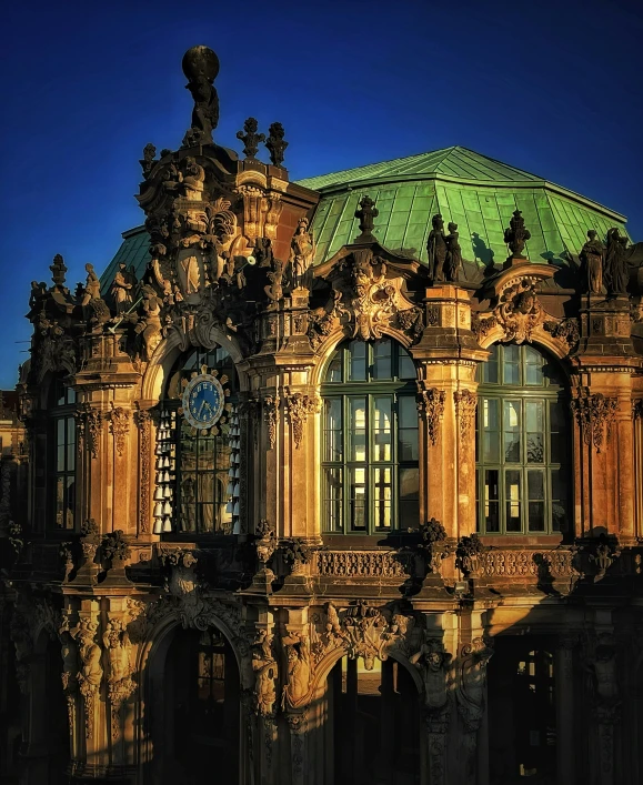 a large building with many windows and clocks on the roof