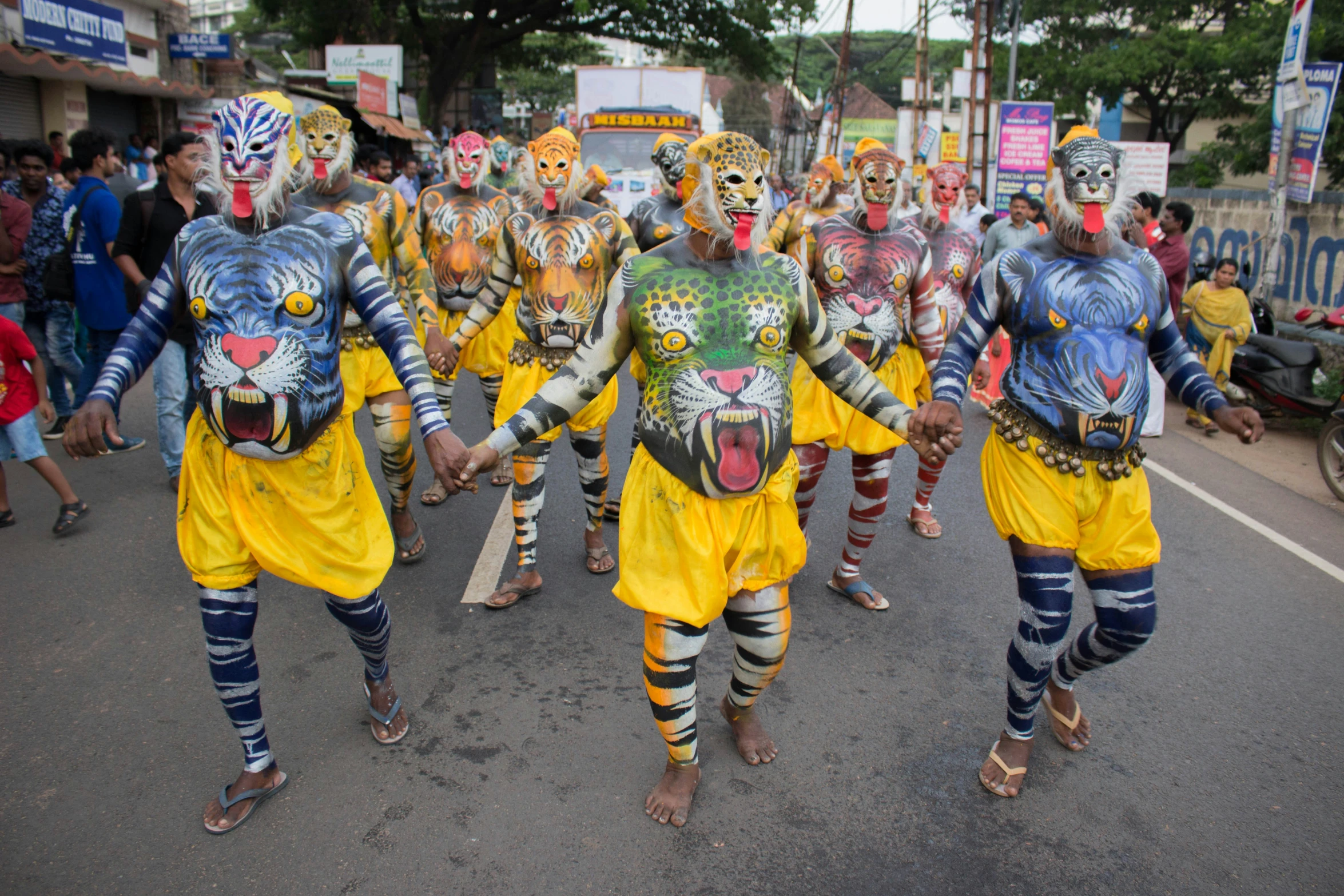 men in costume standing behind others on a street