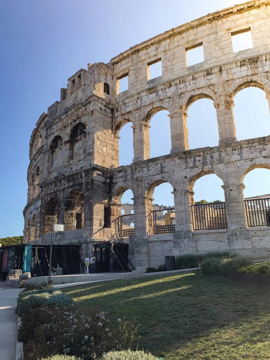 ancient ruins with a building at the front