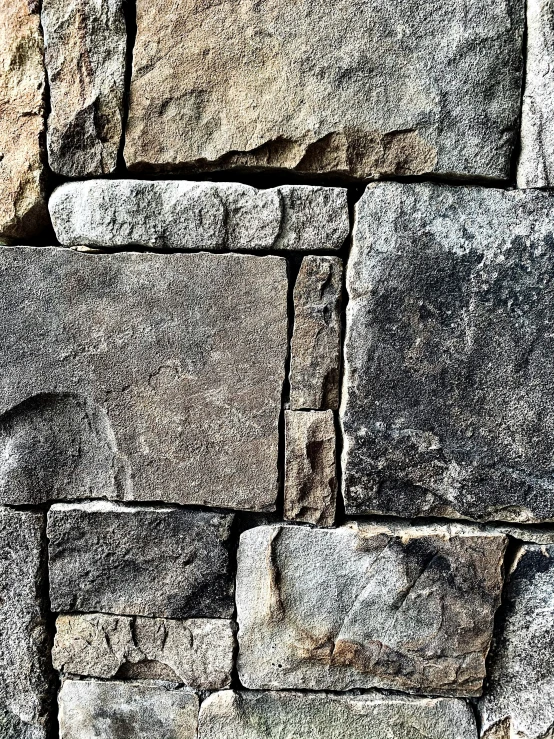 a gray and black pograph of a stone wall