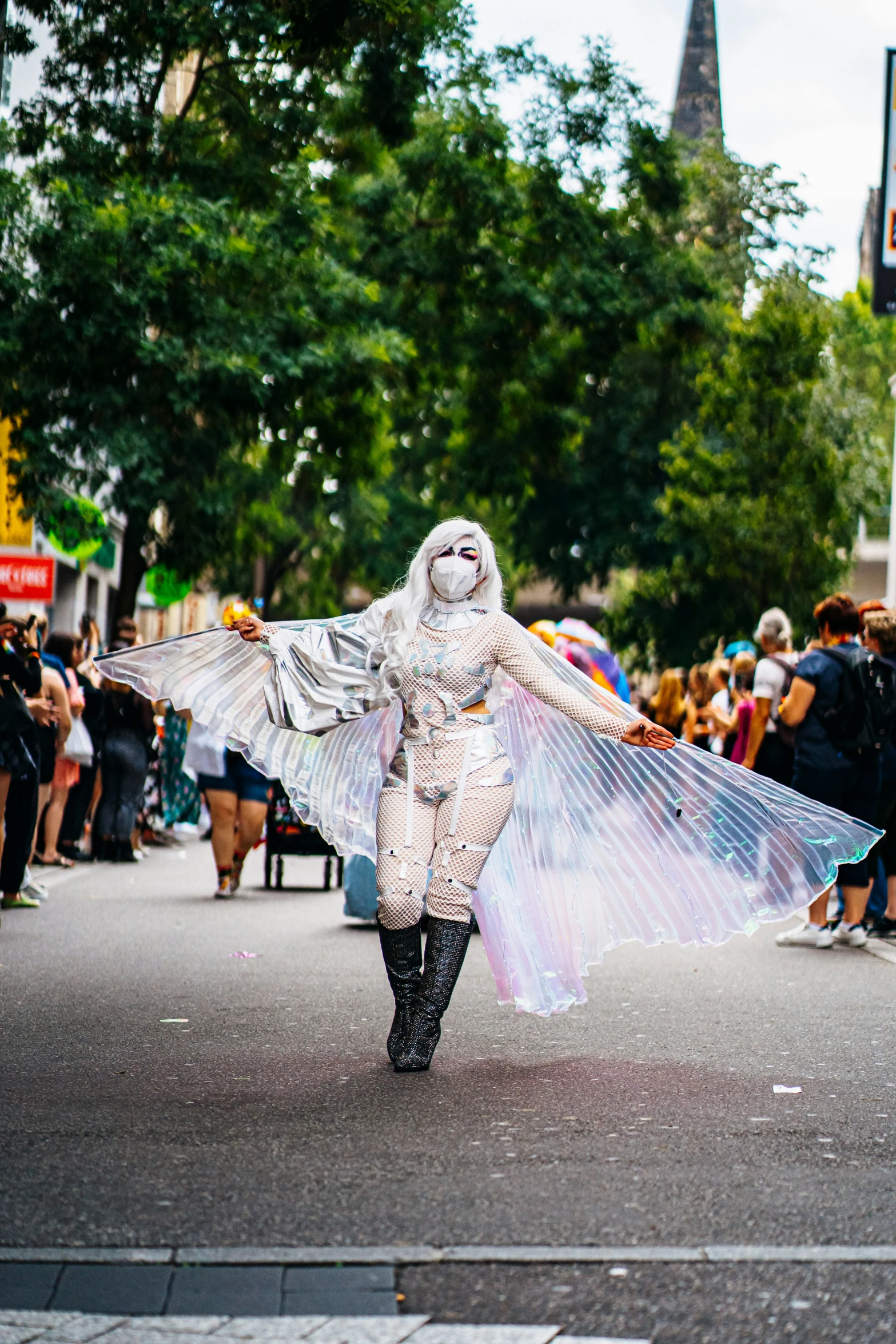 a woman dressed in costume is walking down the street