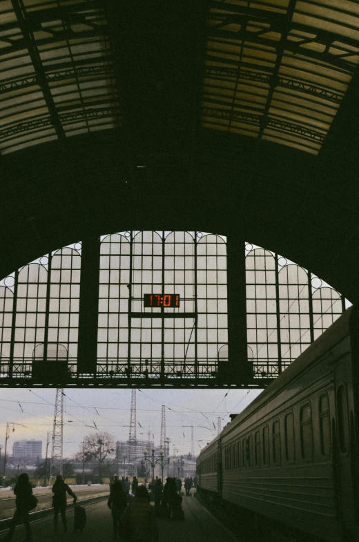 the view out a window over a train at a station