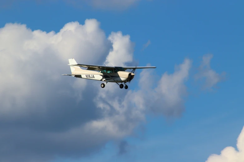 a single engine airplane is in the air