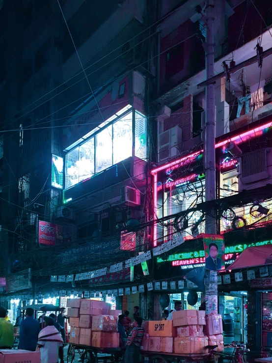 large industrial area with people on trucks at night