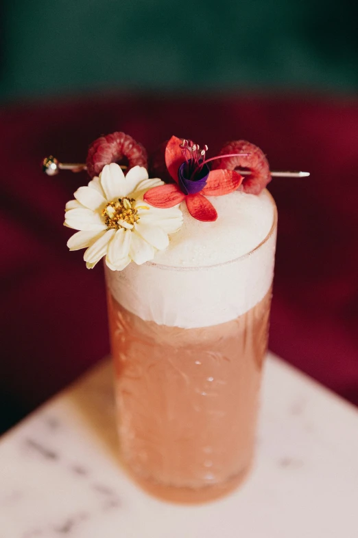 a drink with a flower on the top