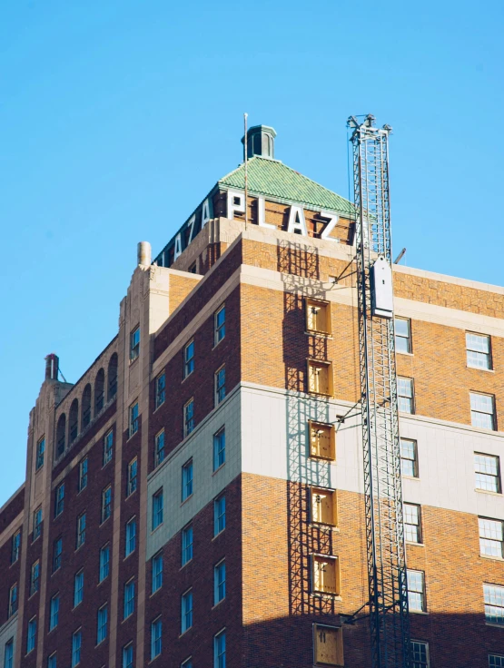 a very tall building with a large metal fire escape