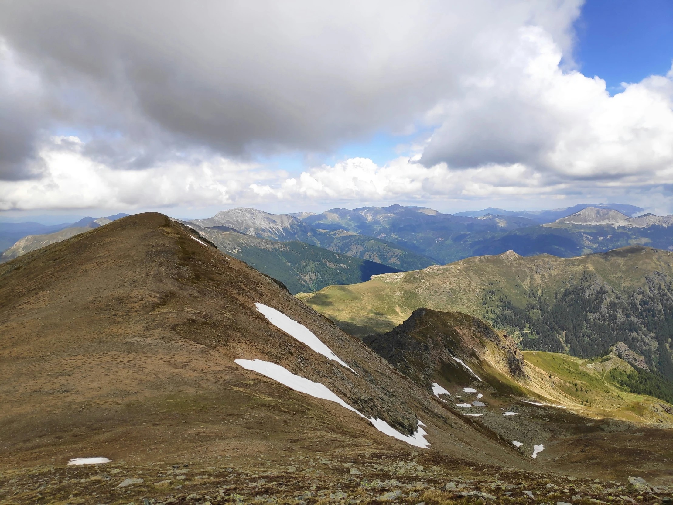 view over the top of the mountain with snow