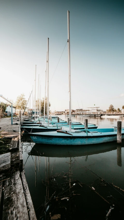 there are many boats on the water being docked