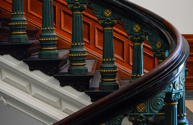 an old banister with decorative hand rails at the bottom