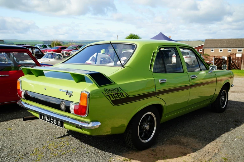 a bright green car parked at a show