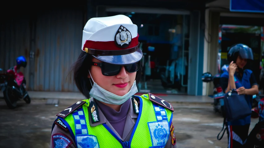 a security guard with her face covered by a mask