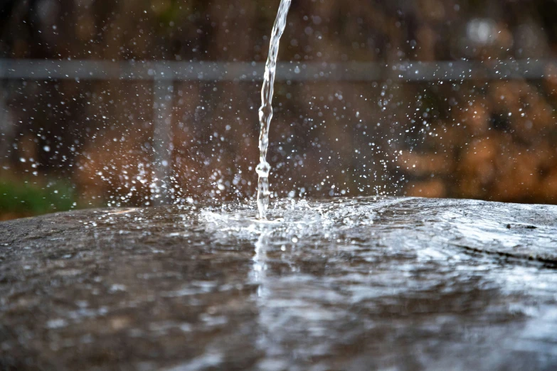 a sprinkle that is flowing down a fountain