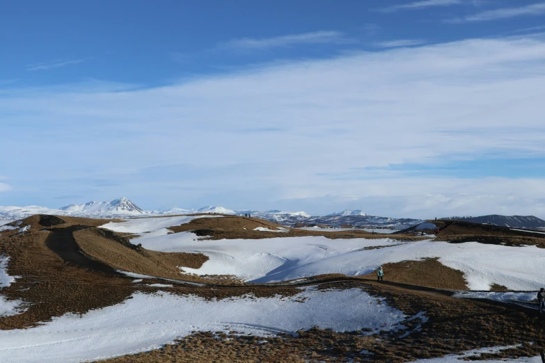 an empty road on a snowy mountain landscape