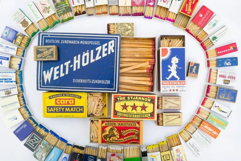 many different types and colors of cigars and matches