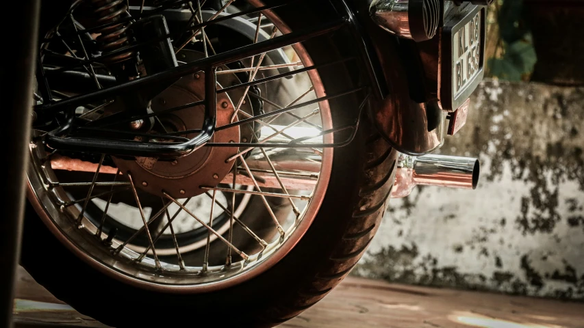 closeup of a motorcycle tire and wheel and chain on the front