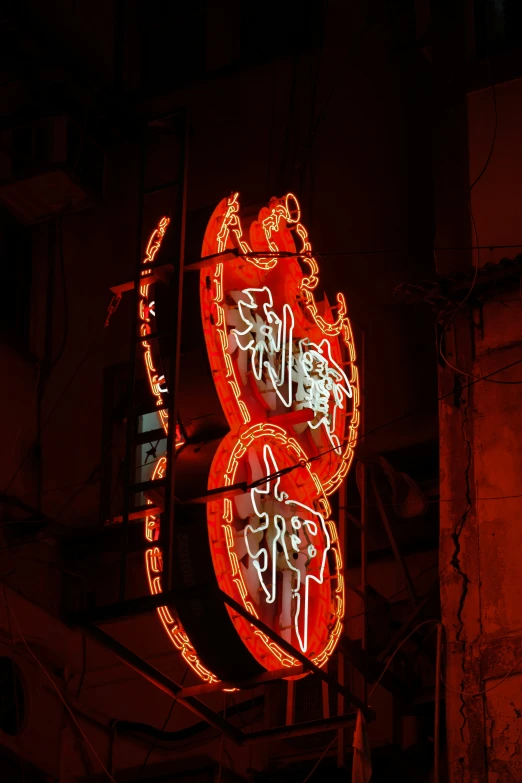 a red illuminated sign saying,'6 ten,'and'eight - five nine eight thirteen five eleven eleven '