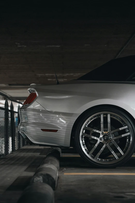 a sports car parked in a parking garage