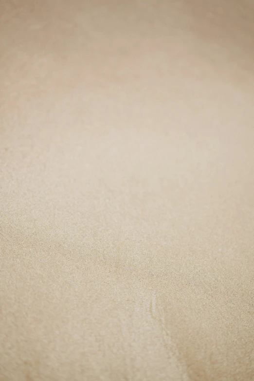 a surf board is seen on a beach