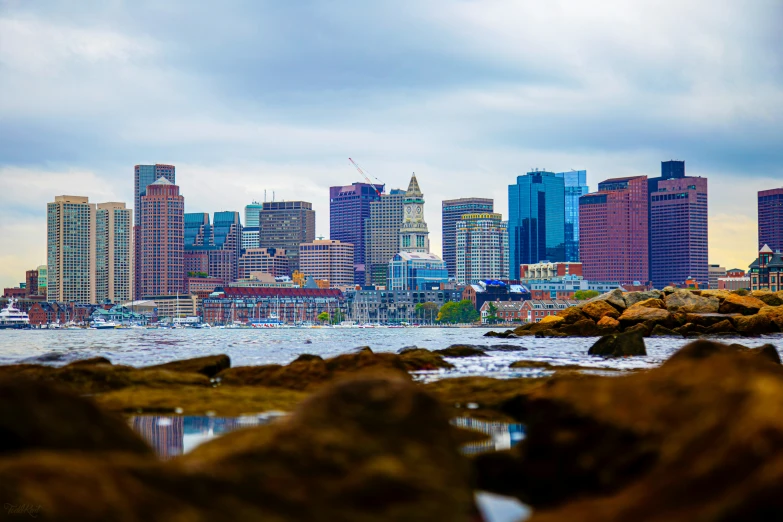 a large city is seen through the cloudy sky