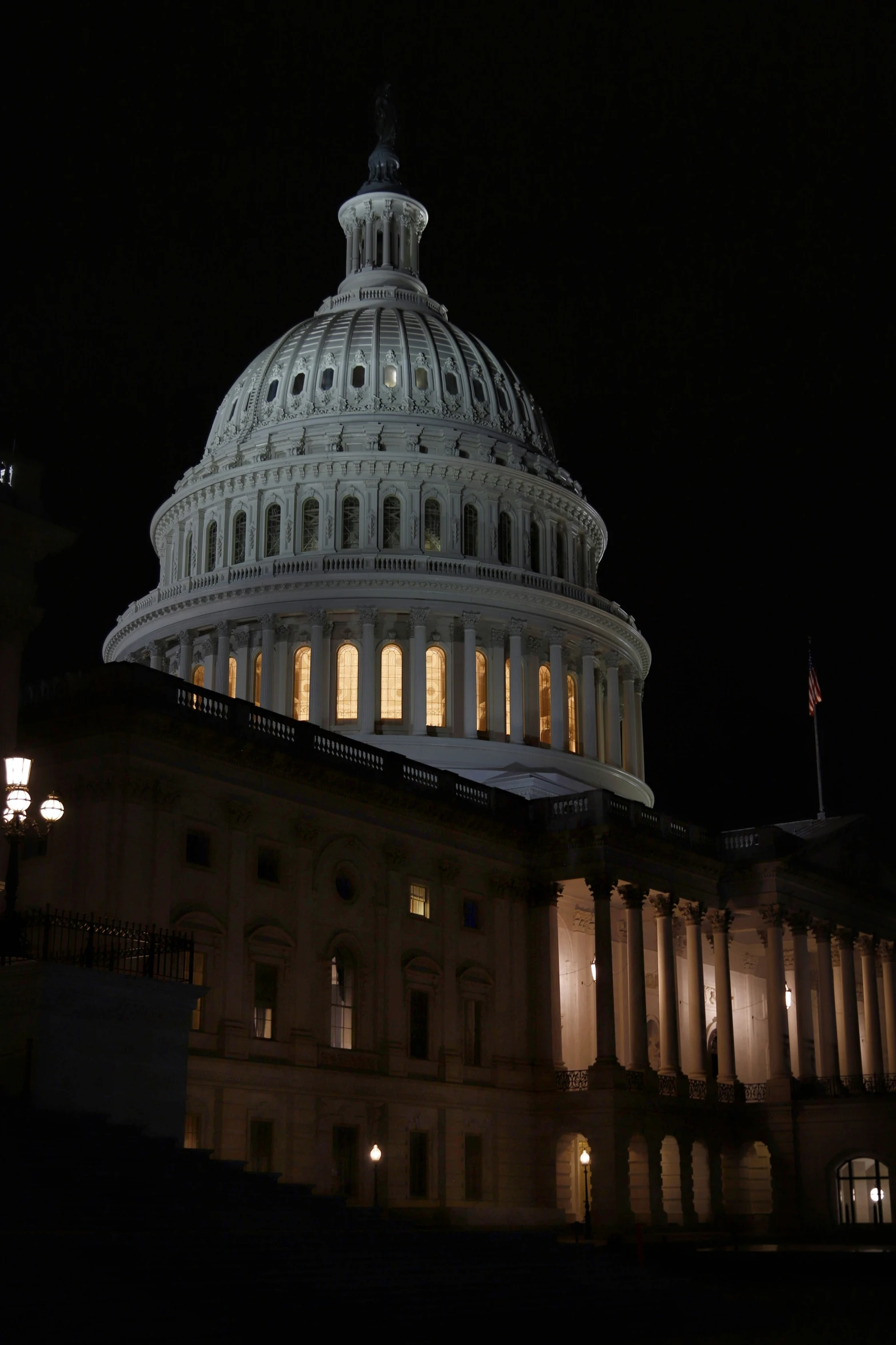 the capital building is illuminated up at night