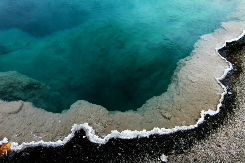 an aerial view of the ocean and land