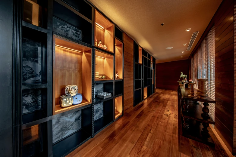 this is a long room with wooden shelving and walls