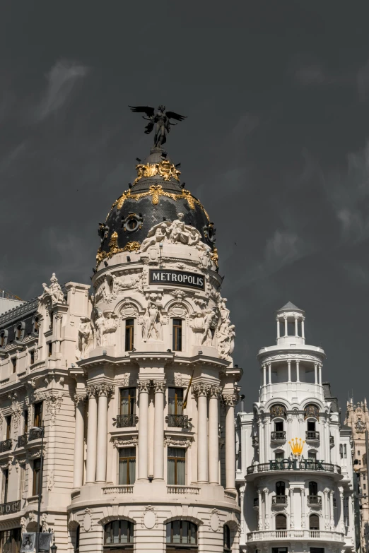 a large white building with a gold - trimming eagle on top