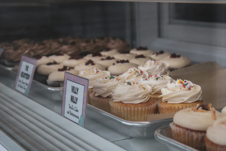 a view of a pastry bakery with the dessert display in it